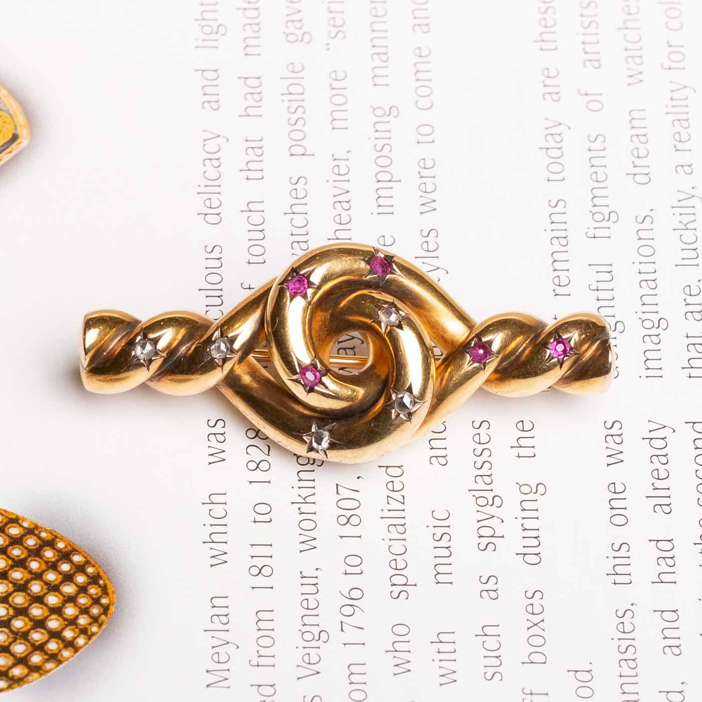 Antique Knot brooch with rubies and diamonds